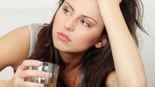 young girl drinking alcohol - photo by Piotr Marcinski