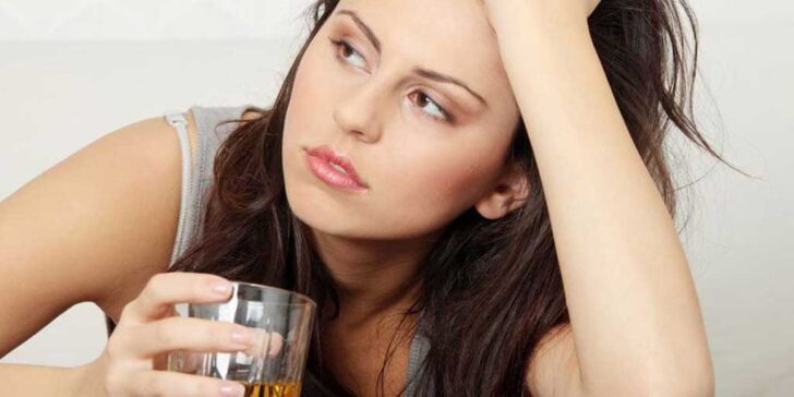 young girl drinking alcohol - photo by Piotr Marcinski