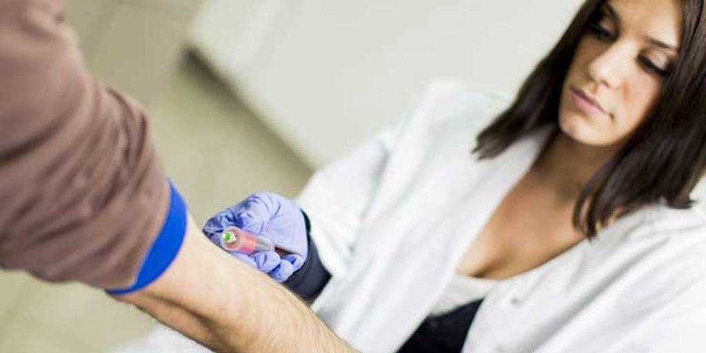 Healthcare professional taking a blood test