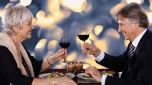 Couple drinking wine - Copyright: Andriy Popov