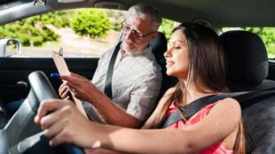 Young woman taking the road skills test